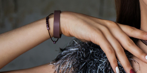 women wearing brown leather bracelets